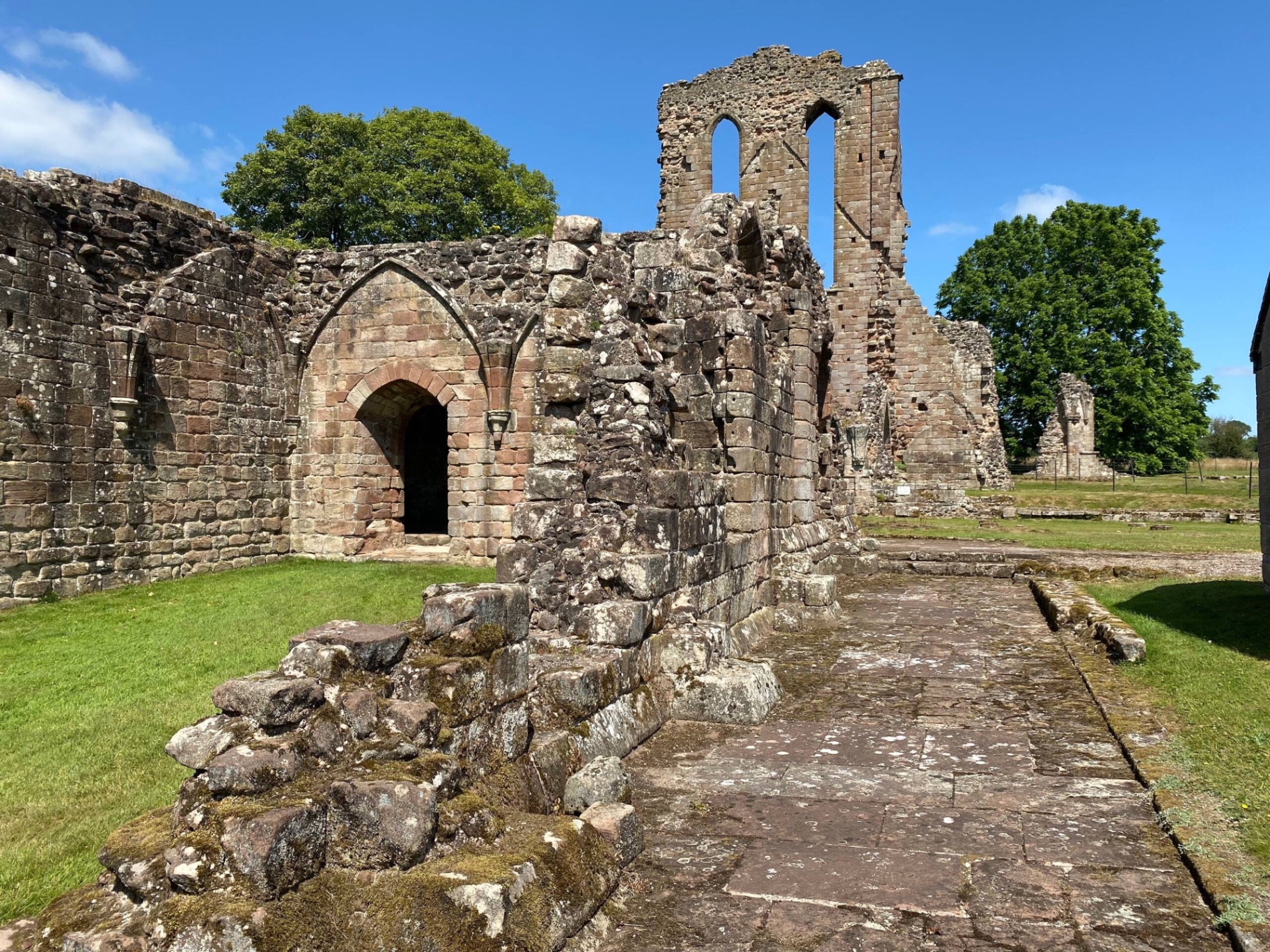 Croxden Abbey ruins — medieval stone arches and walls in a Staffordshire meadow